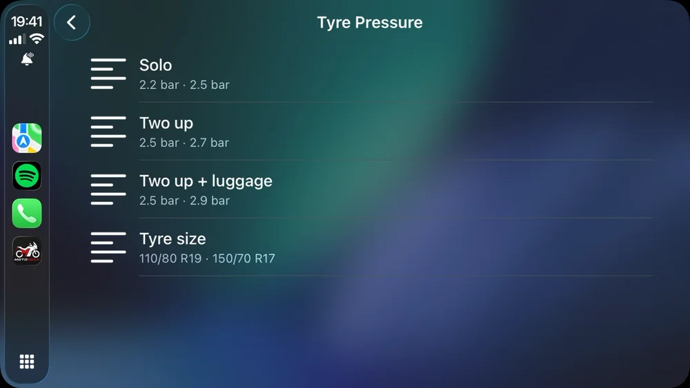 The tyre pressure page on the CarPlay screen: solo, two up, two up with luggage, and the tyre sizes.